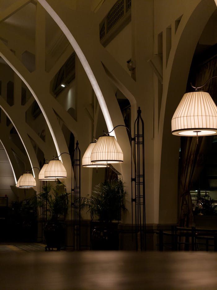 Stylish arched interior with hanging lamps and cozy ambiance, perfect for modern lifestyle themes.